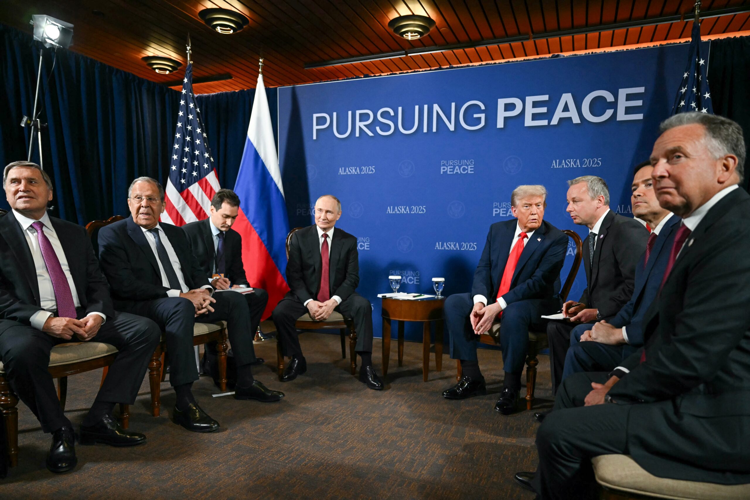 US President Donald Trump (C-R) and Russian President Vladimir Putin (C-L) meet during a US-Russia summit on Ukraine at Joint Base Elmendorf-Richardson in Anchorage, Alaska.