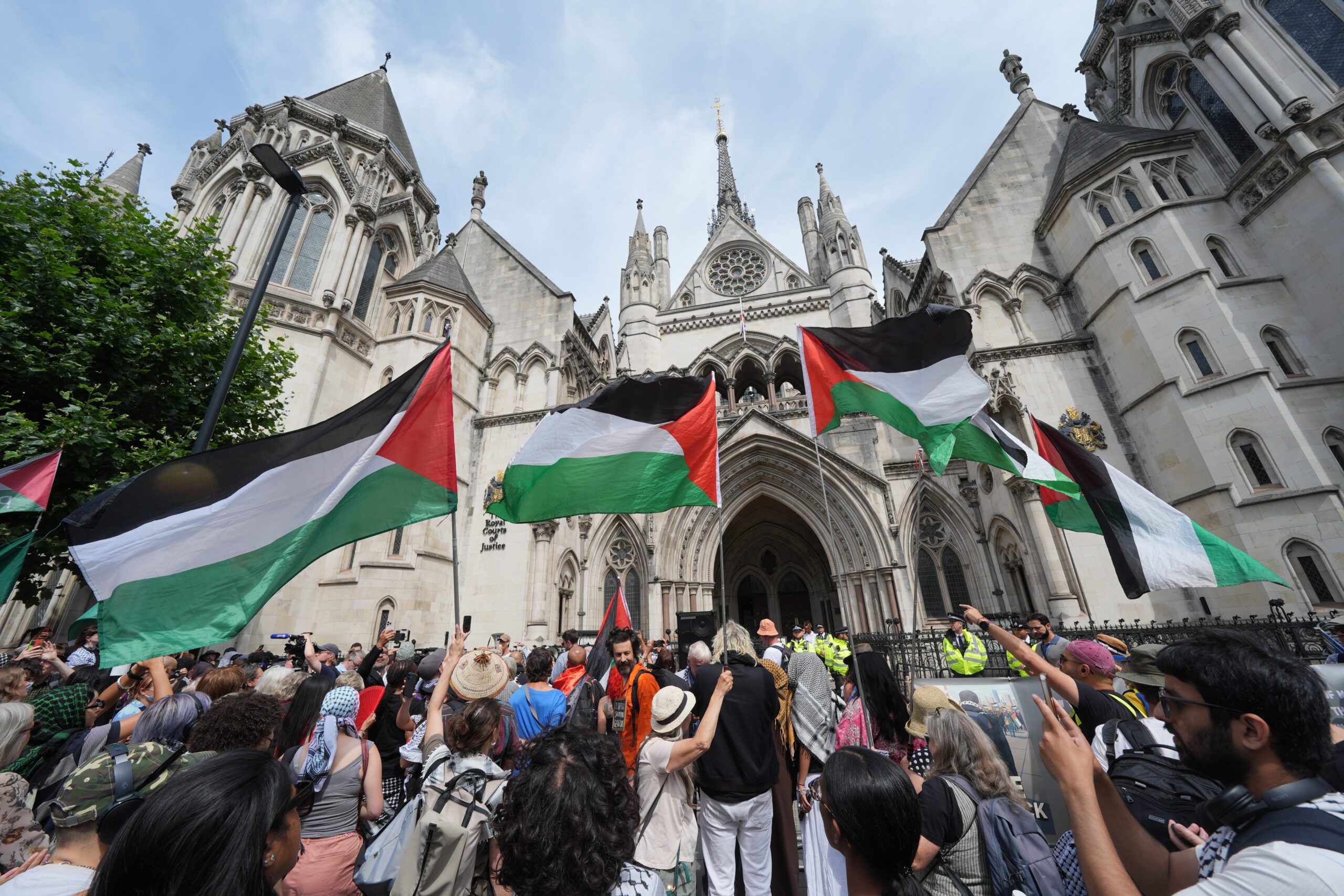 Protesters outside the Royal Courts of Justice on The Strand, central London