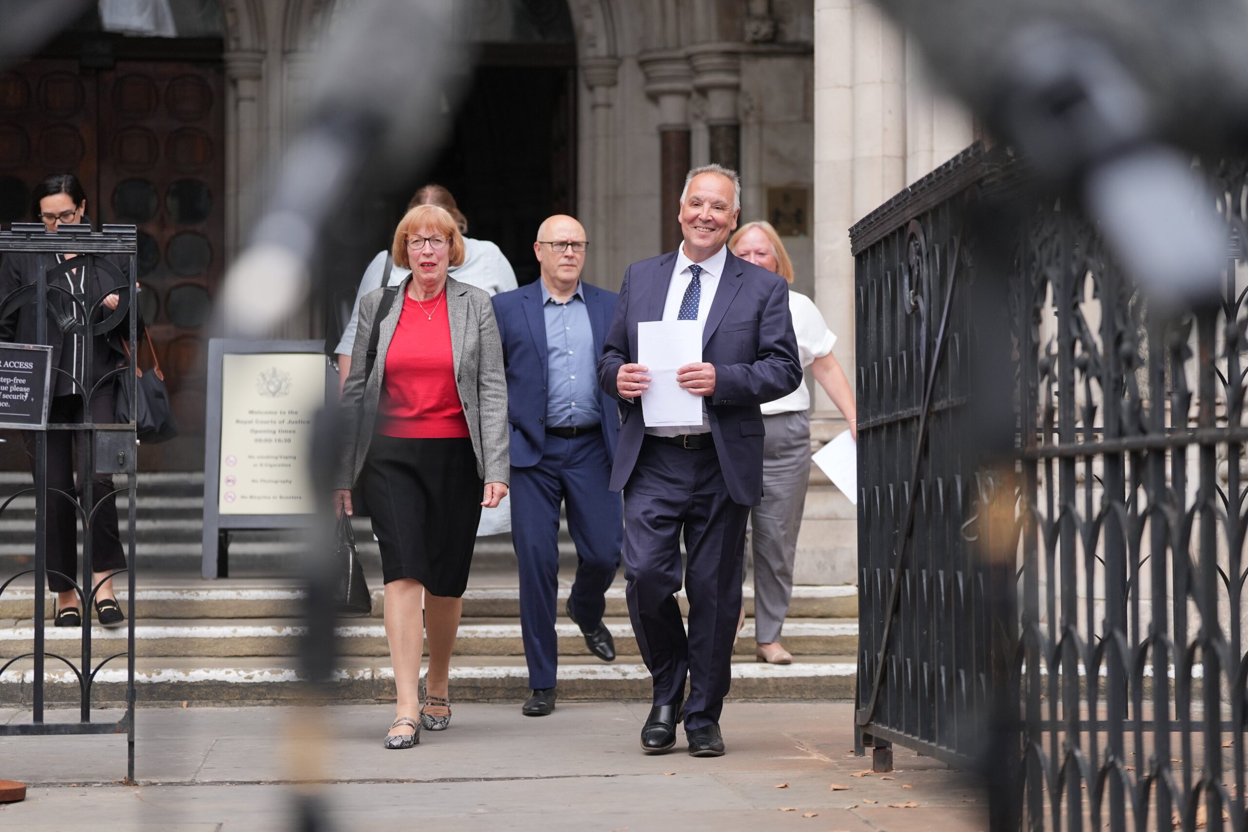 Chris Whitbread, leader of Epping Forest DC, arrives to the media outside the Royal Courts of Justice in London after Epping Forest District Council was granted a temporary High Court injunction blocking asylum seekers from being housed at the Bell Hotel in Epping, Essex.