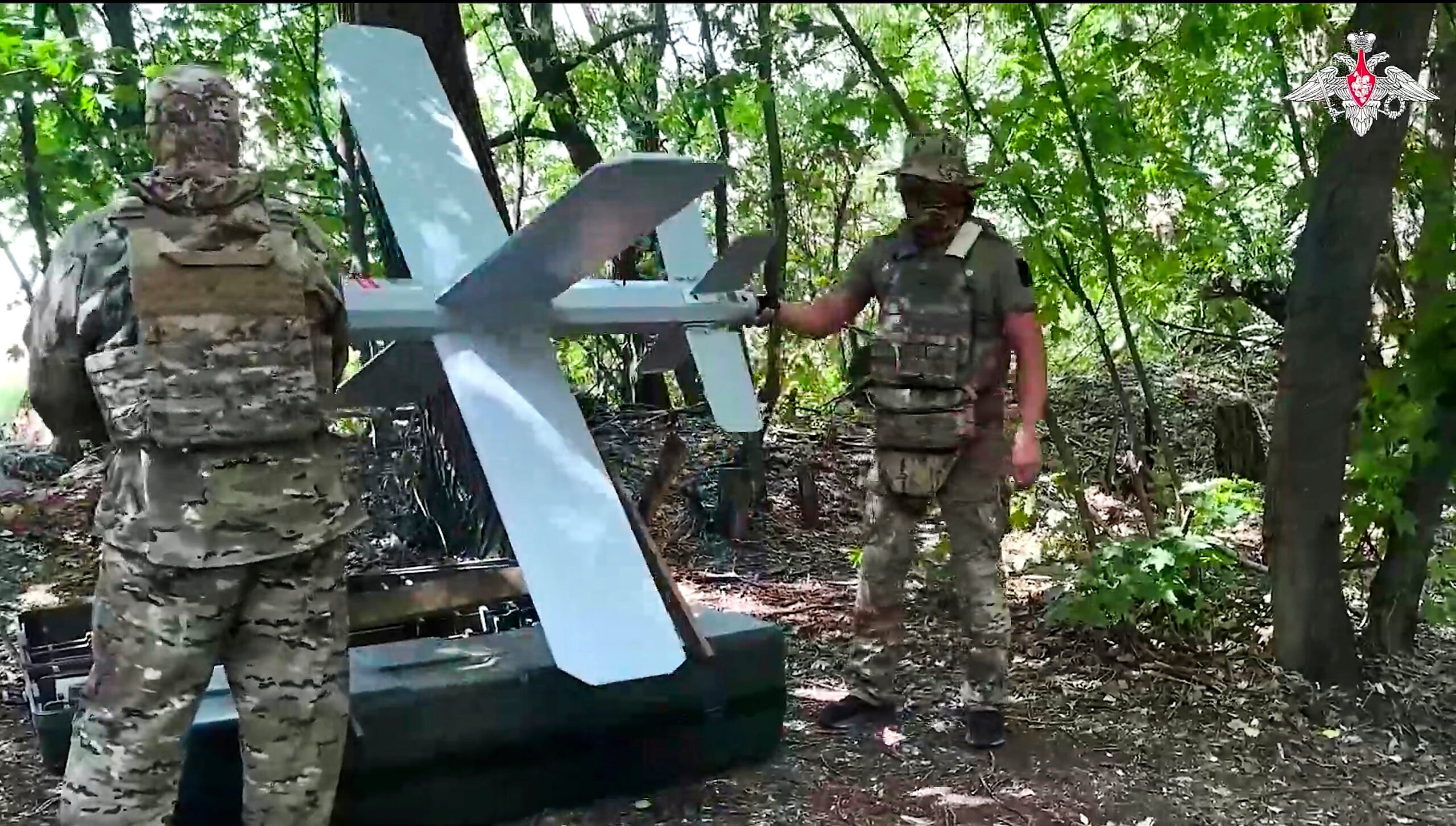 Russian soldiers prepare a Lancet drone for action in an undisclosed location in Ukraine