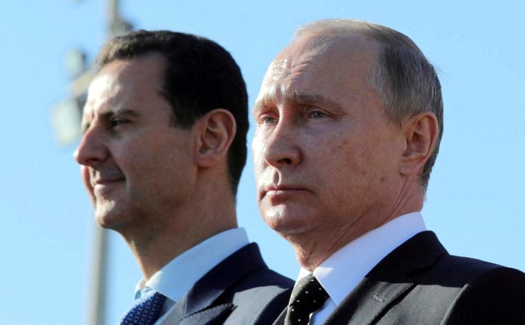 Vladimir Putin and Bashar al-Assad on a visit to the Hmeymim air base in Latakia Province in 2017. The Russian president personally approved an asylum request for the Syrian dictator, although the pair are said to have a frosty personal relationship. (Photo: REUTERS/File Photo)