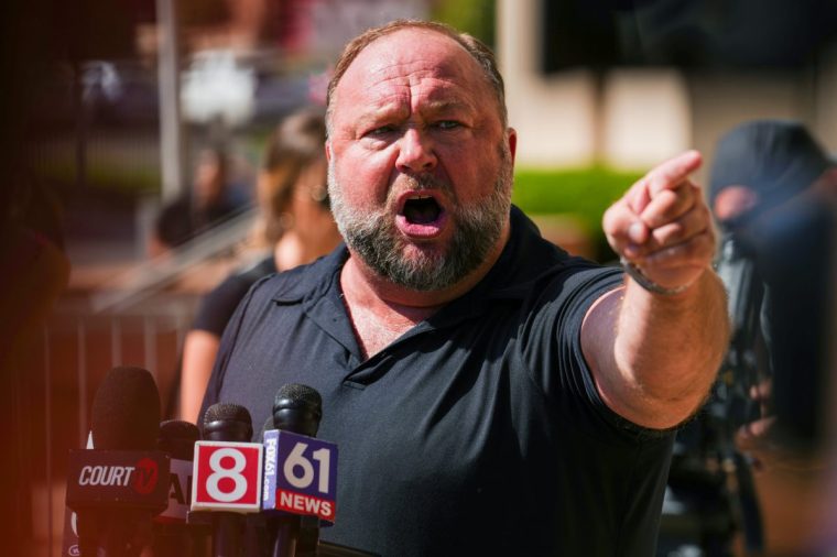 WATERBURY, CONNECTICUT - SEPTEMBER 21: InfoWars founder Alex Jones speaks to the media outside Waterbury Superior Court during his trial on September 21, 2022 in Waterbury, Connecticut. Jones is being sued by several victims' families for causing emotional and psychological harm after they lost their children in the Sandy Hook massacre. A Texas jury last month ordered Jones to pay $49.3 million to the parents of 6-year-old Jesse Lewis, one of 26 students and teachers killed in the shooting in Newtown, Connecticut. (Photo by Joe Buglewicz/Getty Images)