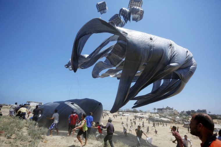 GAZA - AUGUST 02: A plane drops humanitarian aid as efforts continue to airdrop supplies by parachute into the Gaza Strip, which remains under Israeli attacks and blockade, on August 02, 2025. (Photo by Mohammed Nassar/Anadolu via Getty Images)