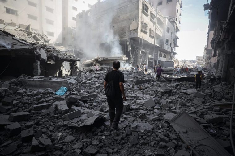 GAZA CITY, GAZA - AUGUST 08: Smoke rises amid debris after Israel targeted the area near Abbas Junction in western Gaza City, Gaza on August 08, 2025. The Israeli army targeted a warned Ajur family home, causing casualties and fatalities. Many nearby buildings were damaged, with smoke billowing from the area. (Photo by Khames Alrefi/Anadolu via Getty Images)