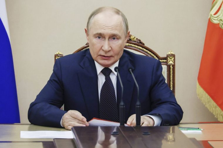 Russian President Vladimir Putin chairs the Security Council meeting at the Kremlin in Moscow, Russia, Friday, Aug. 8, 2025. (Mikhail Metzel, Sputnik, Kremlin Pool Photo via AP)