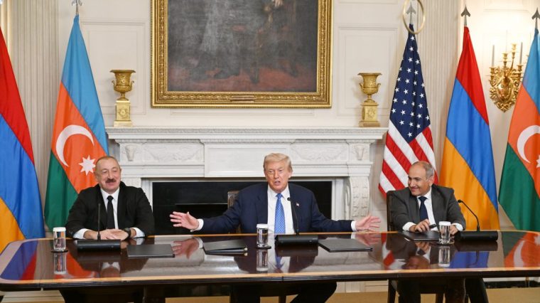WASHINGTON D.C., UNITED STATES - AUGUST 8: (----EDITORIAL USE ONLY - MANDATORY CREDIT - 'AZERBAIJAN PRESIDENCY / HANDOUT' - NO MARKETING NO ADVERTISING CAMPAIGNS - DISTRIBUTED AS A SERVICE TO CLIENTS----) U.S. President Donald Trump (C), Azerbaijani President Ilham Aliyev (L), and Armenian Prime Minister Nikol Pashinyan (R) sign the joint declaration 'peace roadmap' following their trilateral meeting at the White House in Washington D.C., United States on August 08, 2025. (Photo by Azerbaijan Presidency/Anadolu via Getty Images)
