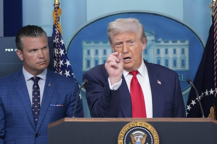 President Donald Trump speaks with reporters in the James Brady Press Briefing Room at the White House, Monday, Aug. 11, 2025, in Washington, as Secretary of Defense Pete Hegseth looks on. (AP Photo/Alex Brandon)