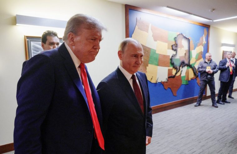 In this pool photograph distributed by the Russian state agency Sputnik, US President Donald Trump (L) and Russian President Vladimir Putin (R) walk to hold a joint press conference following a US-Russia summit on Ukraine at Joint Base Elmendorf-Richardson in Anchorage, Alaska, on August 15, 2025. (Photo by Gavriil GRIGOROV / POOL / AFP) (Photo by GAVRIIL GRIGOROV/POOL/AFP via Getty Images)