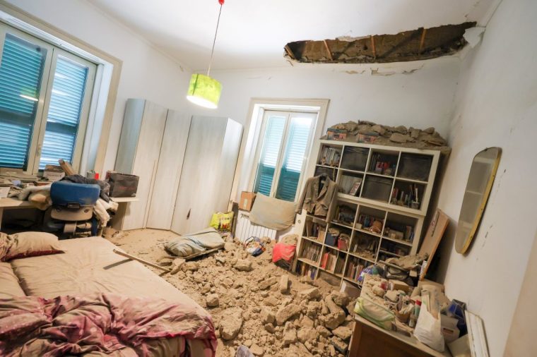 NAPLES, CAMPANIA, ITALY - 2025/03/13: Part of the attic of a house collapsed, after an earthquake of magnitude 4.4 was recorded in the Campi Flegrei area at 1:25 am. The epicenter was near Pozzuoli. It was the strongest recorded with the phenomenon of bradyseism. (Photo by Salvatore Laporta/KONTROLAB/LightRocket via Getty Images)