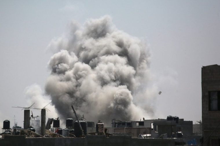 Smoke billows after an Israeli strike on a building in Jabalia in the northern Gaza Strip on August 20, 2025. Israel's defence minister approved a plan on August 20, for the conquest of Gaza City and authorised the call-up of around 60,000 reservists, piling pressure on Hamas as mediators push for a ceasefire. (Photo by BASHAR TALEB / AFP) (Photo by BASHAR TALEB/AFP via Getty Images)