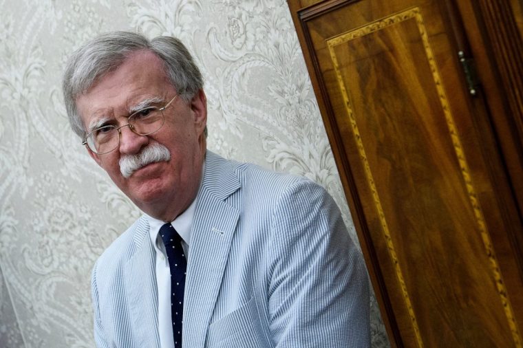 (FILES) National Security Advisor John Bolton waits for a meeting between Dutch Prime Minister Mark Rutte and US President Donald Trump in the Oval Office of the White House on July 2, 2018 in Washington, DC. Federal Bureau of Investigation agents searched on Friday the home of John Bolton, Donald Trump's former national security advisor who has become a vocal critic of the US president. (Photo by Brendan Smialowski / AFP) (Photo by BRENDAN SMIALOWSKI/AFP via Getty Images)
