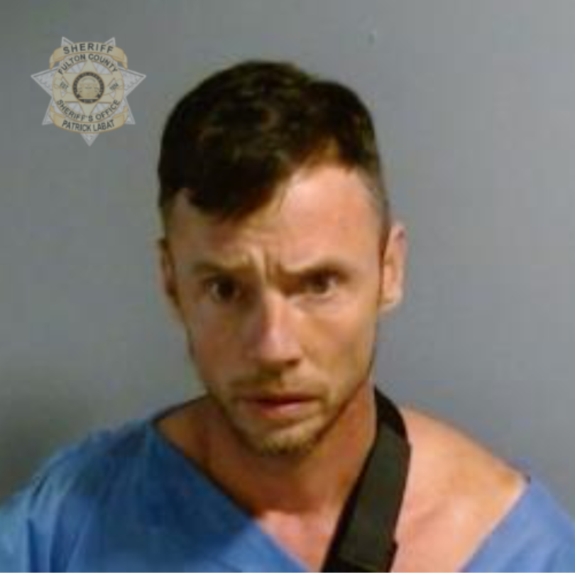 Christopher Wolfenbarger, pictured in a booking photo, was arrested for the 1999 murder of his wife