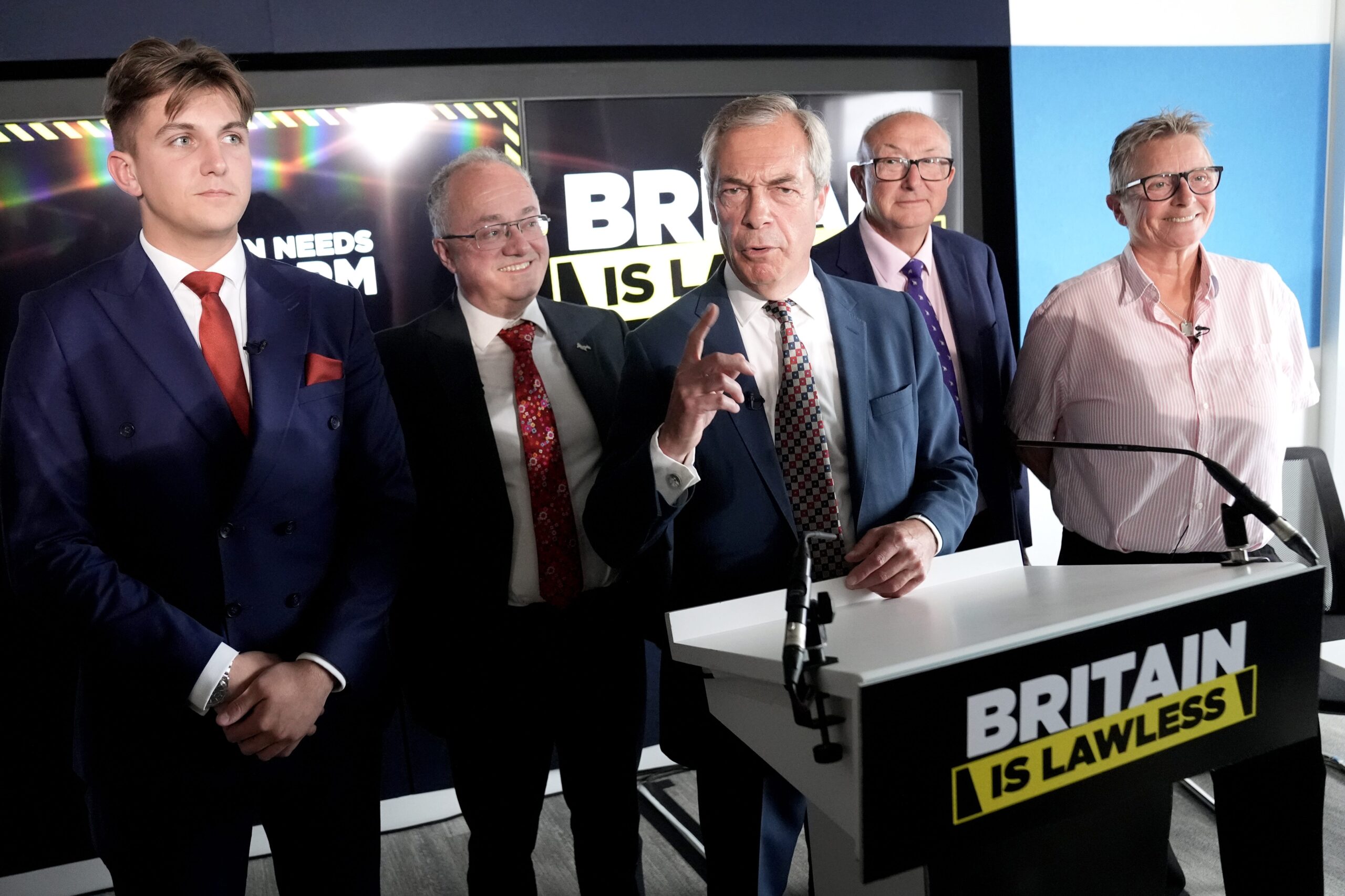 Reform UK party leader Nigel Farage and (left to right) the leader of Warwickshire County Council, Reform’s George Finch, the police and crime commissioner for Leicestershire, Rupert Matthews, Reform UK policing and crime advisor, Colin Sutton and Reform UK’s new justice adviser and former prison governor Vanessa Frake-Harris (PA/Stefan Rousseau)