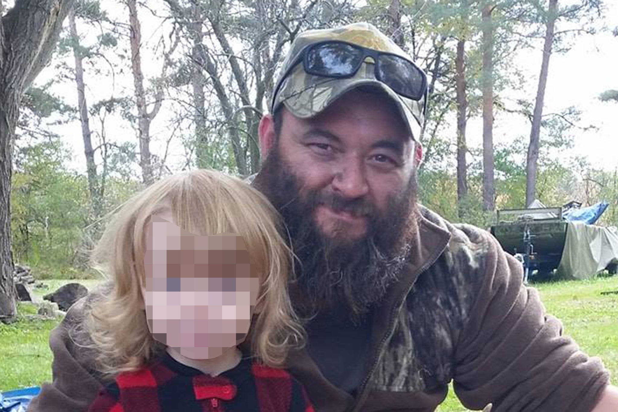 Sanford in a photo with his son, posted on a Facebook fundraising page