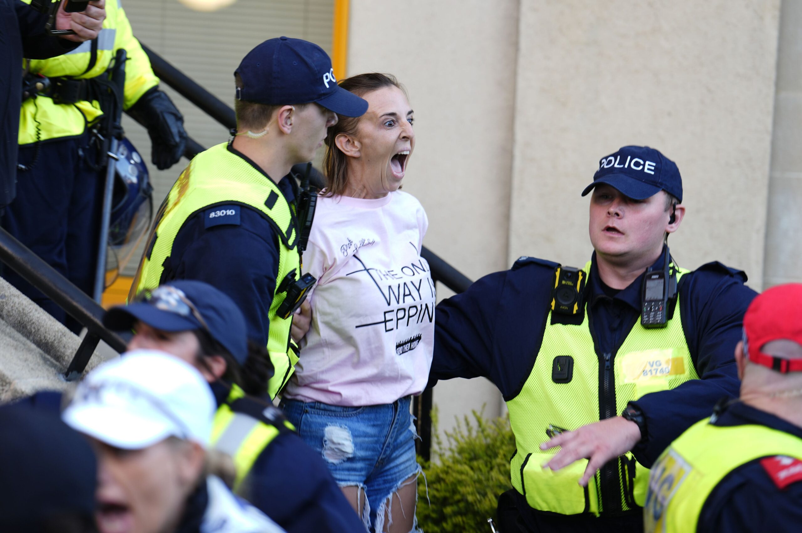 A protester detained by police in Epping (Jordan Pettitt/PA)