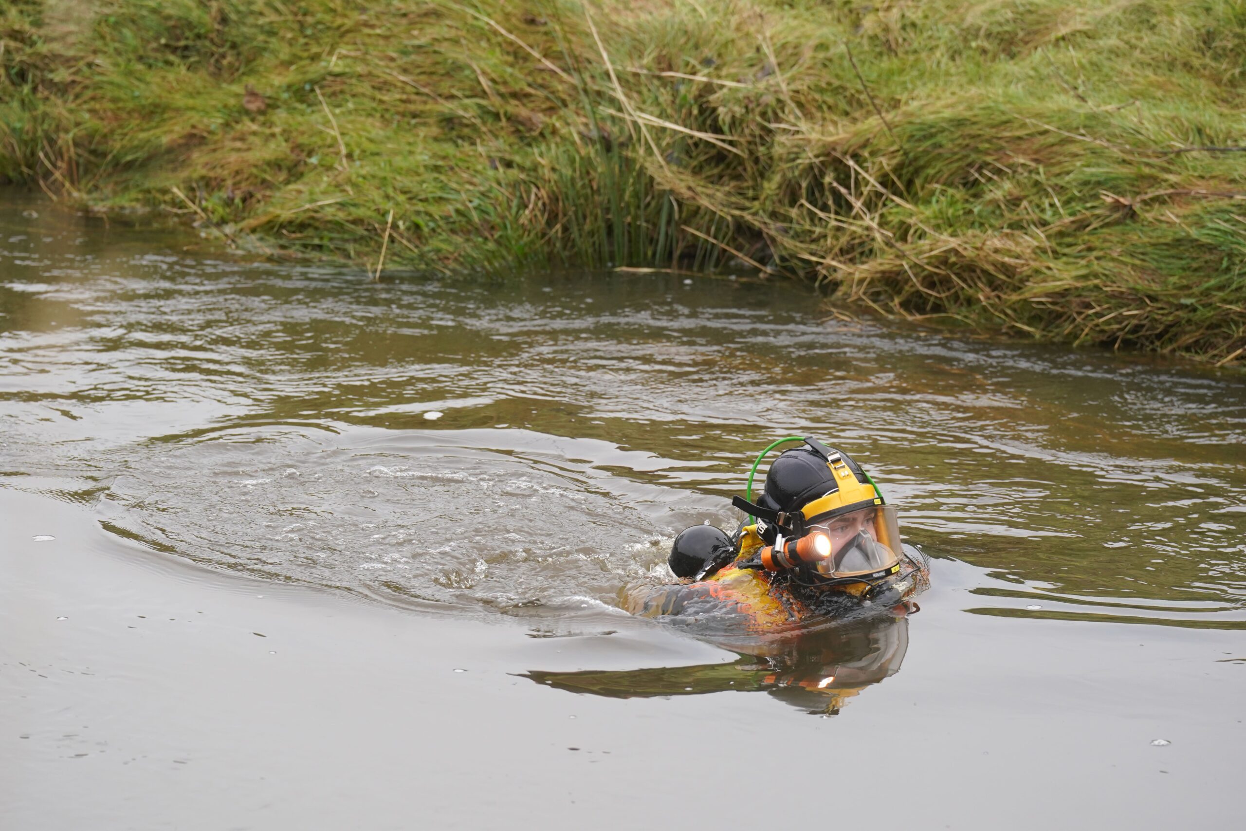 Divers searching the water at Abberwick Ford on the River Aln near Alnwick after Mr Voyce went missing
