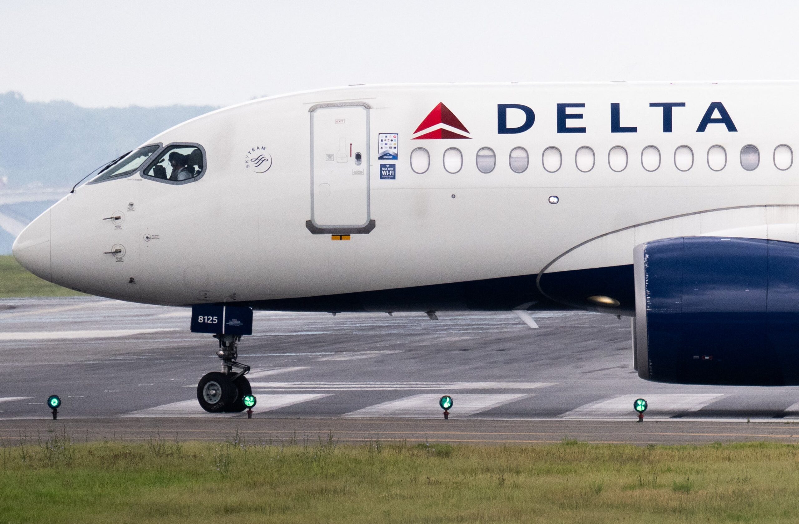 A Delta Air Lines Airbus A220 airplane prepares to take off at Ronald Reagan Washington National Airport in July 2025