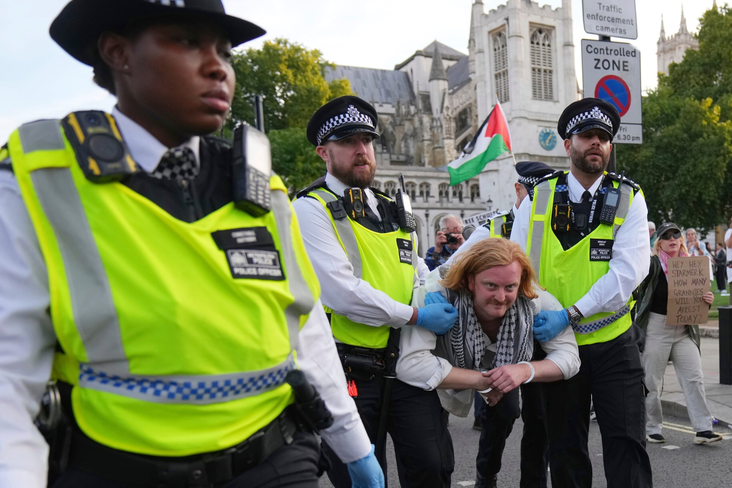 Police officers carry during a march to support Palestine Action in London last month