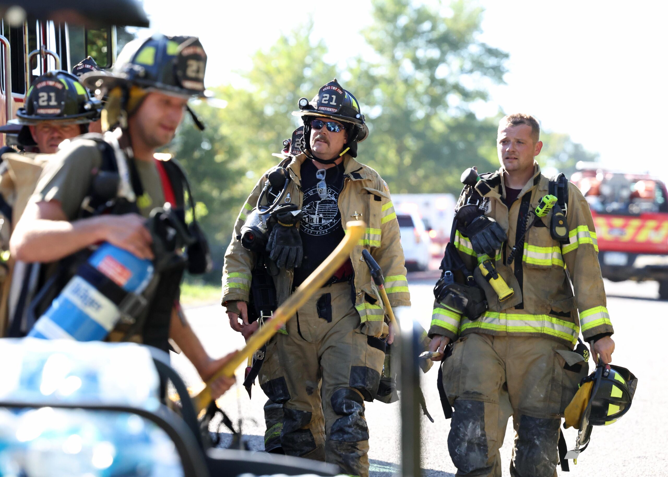 Firefighters from Atlas Township, return to their vehicles after taking care of a fire after a shooting at The Church of Jesus Christ of Latter-day Saints, Sunday, 28 September 2025