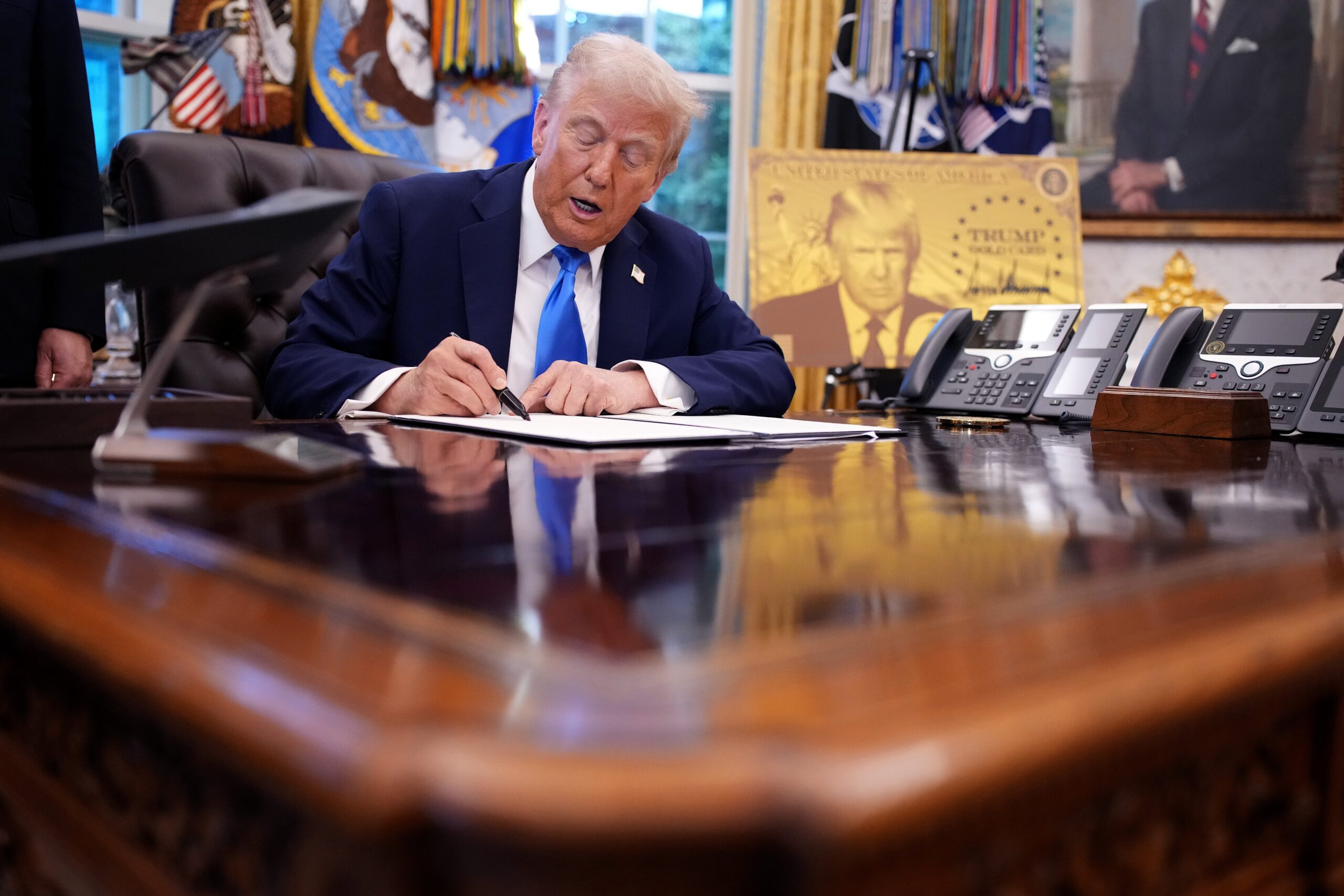 Donald Trump signs a proclamation imposing a $100,000 fee on H-1B visa applications