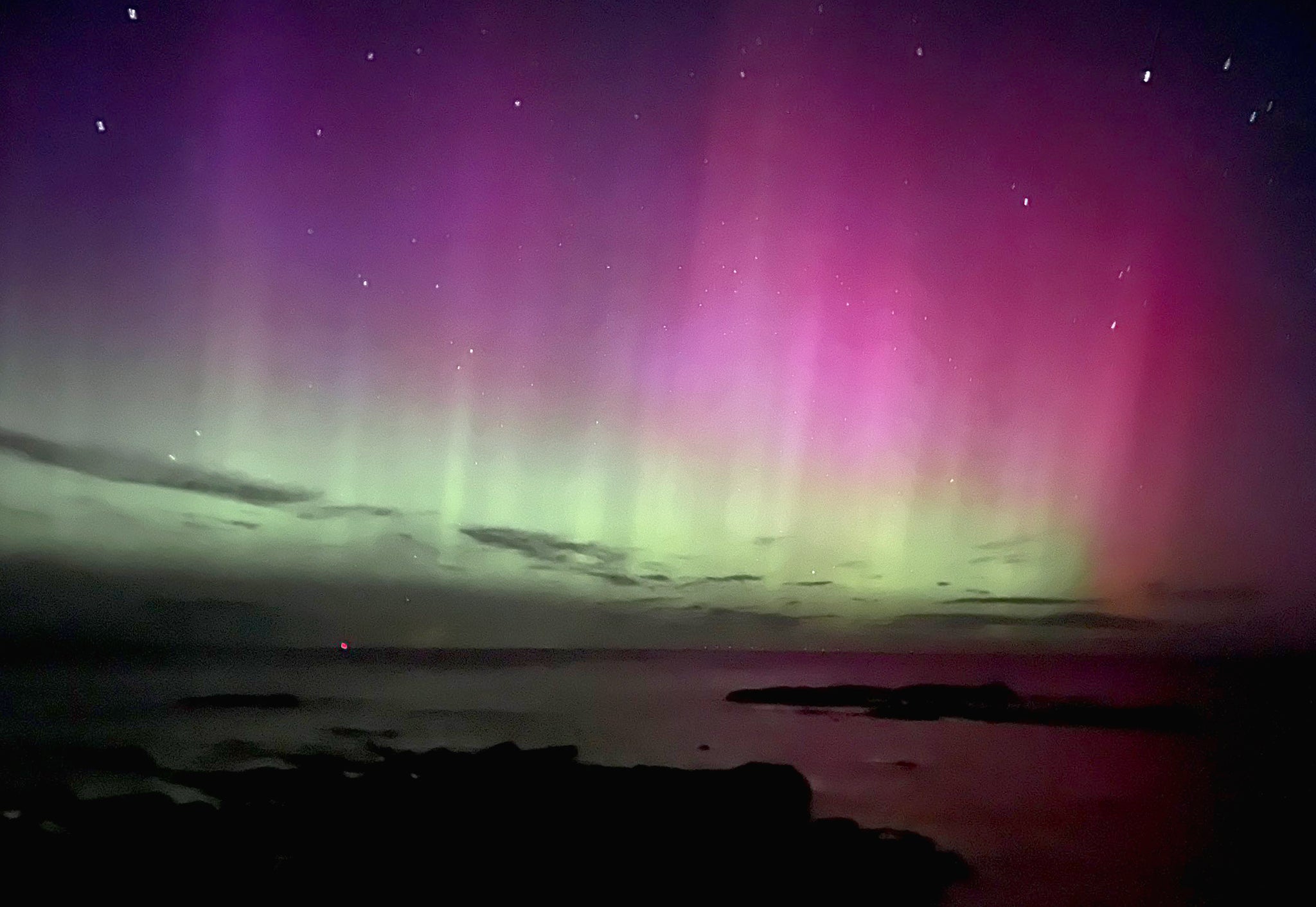 Northern Lights (aurora borealis) photographed at Hopeman village in Moray, Scotland.