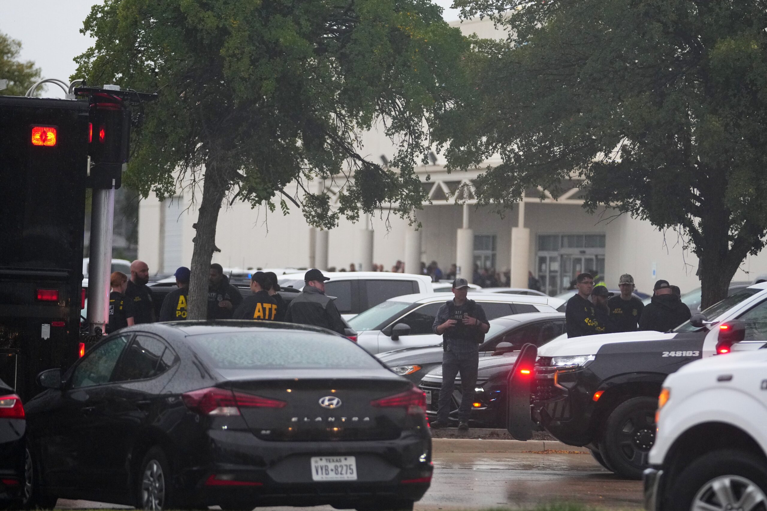 In total, four people were shot in the violence that unfolded Wednesday morning, including the suspect who died from a self-inflicted gunshot wound, Dallas police said
