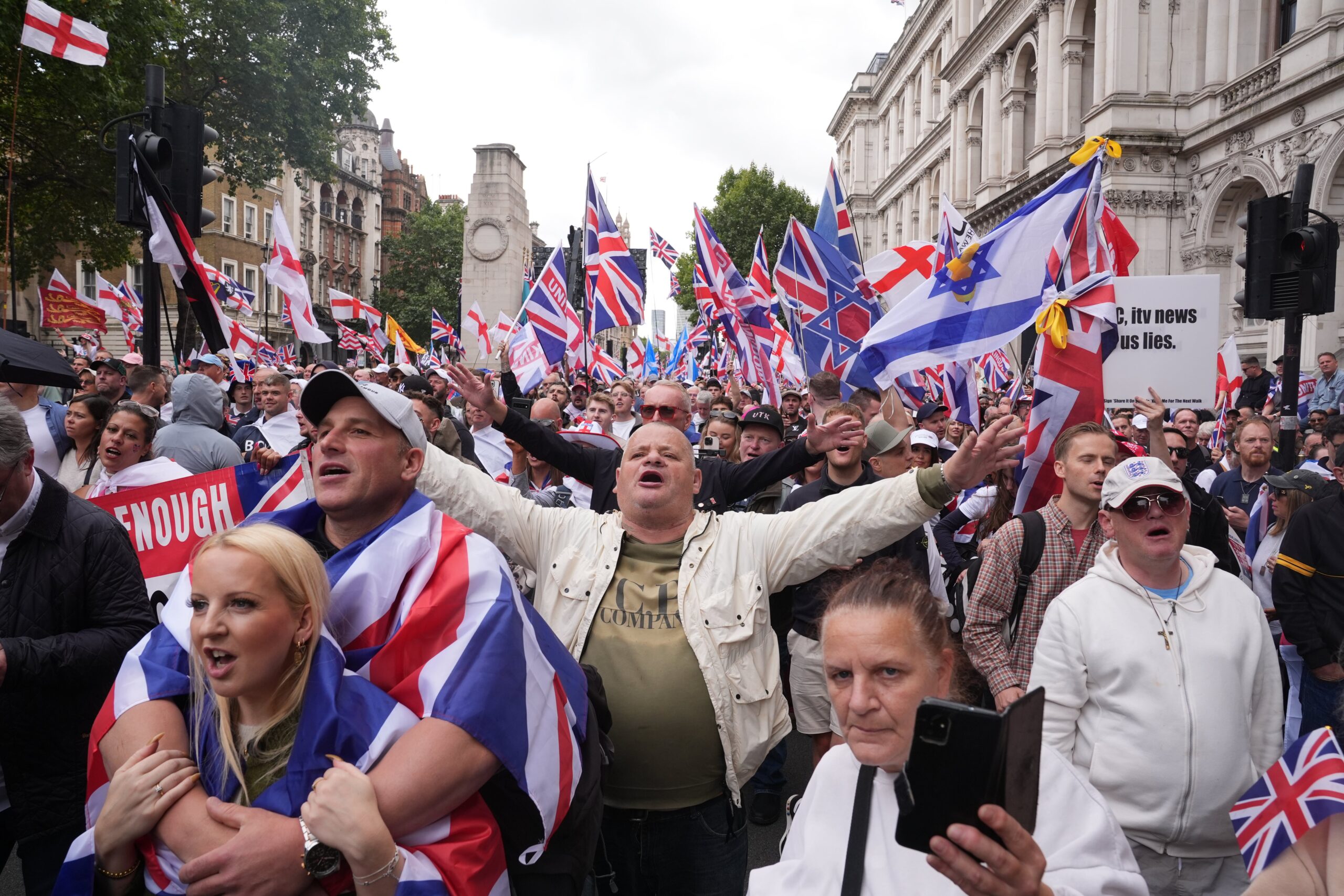 Activists gather at the Cenotaph during the Tommy Robinson-led Unite the Kingdom march and rally in central London.