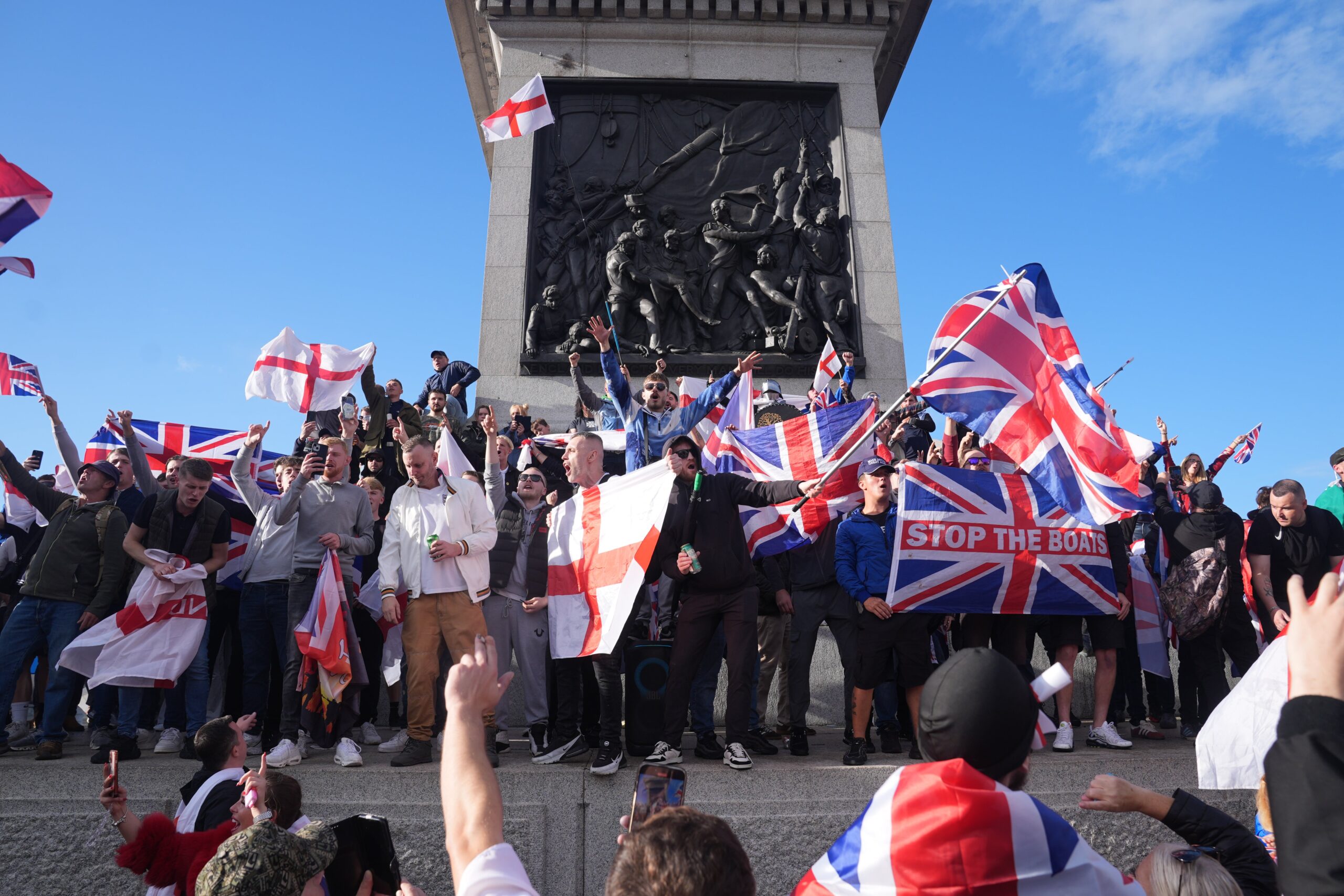 People taking part in a Tommy Robinson-led Unite the Kingdom march and rally in Trafalgar Square, central London.