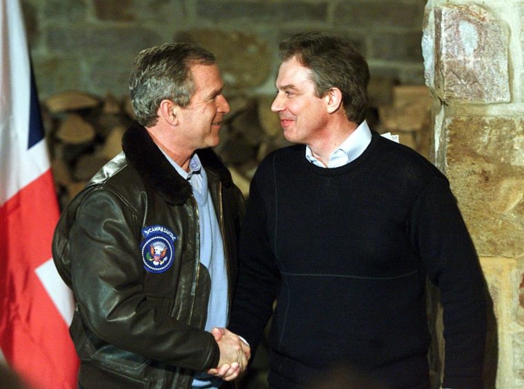 THURMONT, UNITED STATES: US President George W. Bush (L) and British Prime Minister Tony Blair shake hands after a joint press conference 23 February 2001, in Thurmont, Maryland, down the road from the presidential retreat Camp David. Blair and his wife are scheduled to remain overnight at Camp David with the Bushes. AFP PHOTO MARIO TAMA (Photo credit should read MARIO TAMA/AFP/Getty Images)