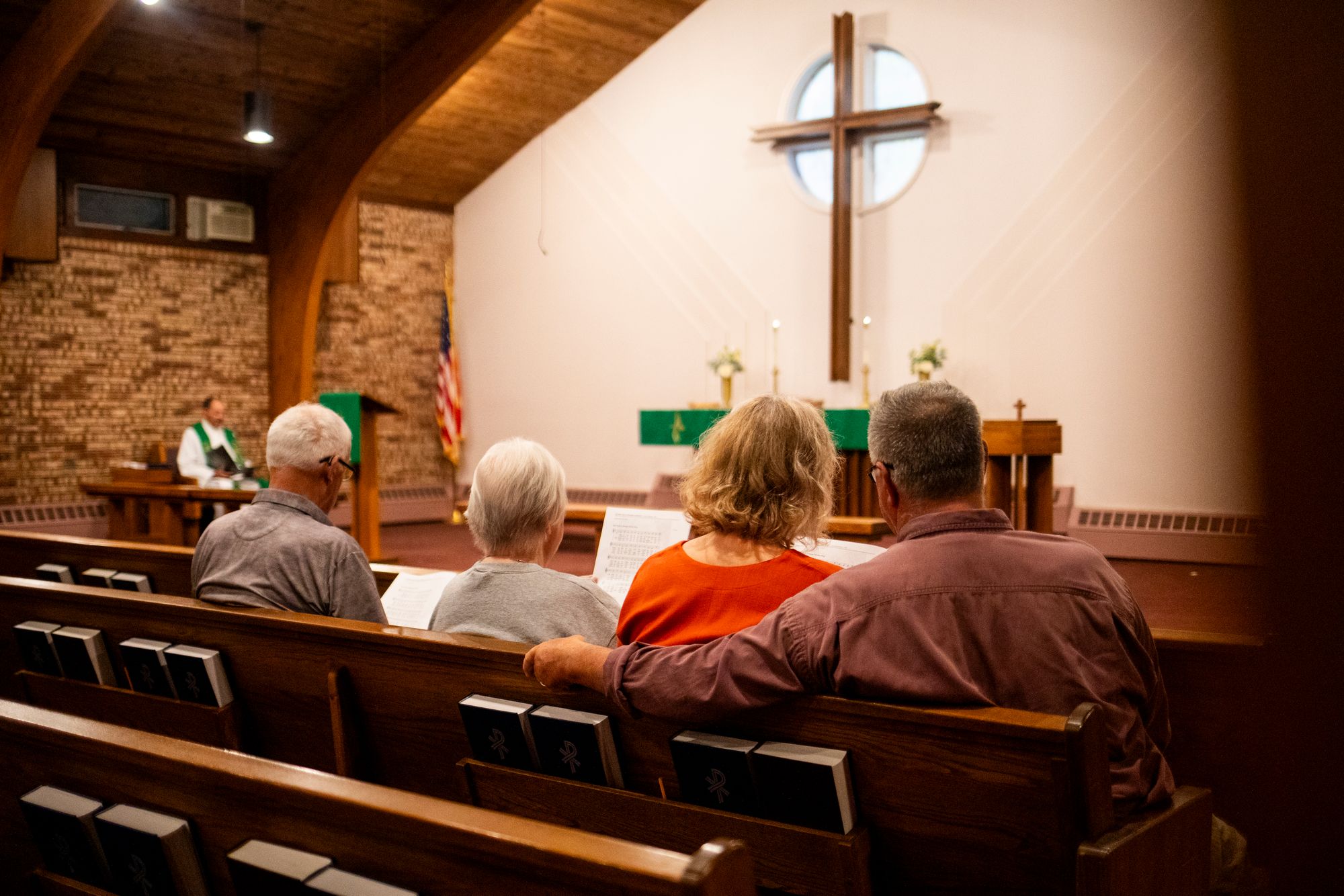 Grand Blanc residents gather for a prayer service on Monday. Law enforcement officials have praised the heroic actions of first responders and churchgoers who helped people at the scene of the shooting on Sunday morning