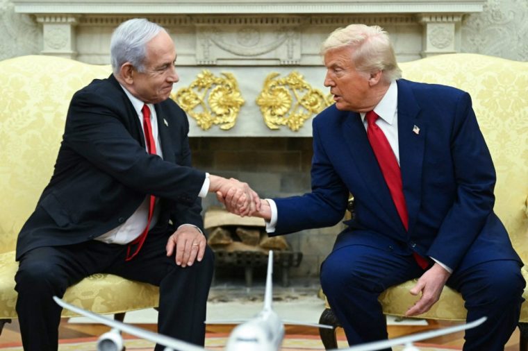 (FILES) US President Donald Trump shakes hands with Israeli Prime Minister Benjamin Netanyahu during a meeting in the Oval Office of the White House in Washington, DC, on April 7, 2025. Israeli Prime Minister Benjamin Netanyahu will visit the White House on July 7 for talks with President Donald Trump, a US administration official told AFP on June 30, 2025, as Washington presses for a ceasefire in Gaza. (Photo by SAUL LOEB / AFP) (Photo by SAUL LOEB/AFP via Getty Images)