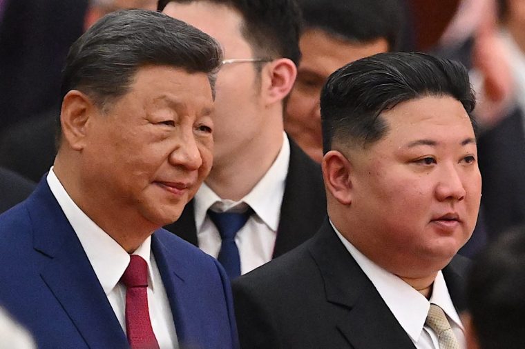 China's President Xi Jinping (L) and North Korea's leader Kim Jong Un arrive for a reception in the Great Hall of People, following a military parade marking the 80th anniversary of victory over Japan and the end of World War II, in Beijing on September 3, 2025. (Photo by Jade Gao / AFP) (Photo by JADE GAO/AFP via Getty Images)