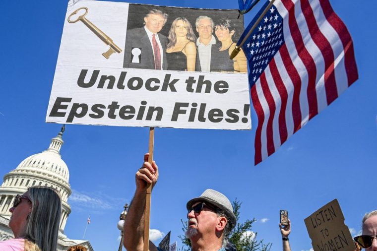 Demonstrators carry signs in support of the victims of sex offender Jeffrey Epstein and his accomplice Ghislaine Maxwell near a press conference held by US representatives outside the U.S. Capitol in Washington, DC on September 3, 2025. A US House of Representatives committee released a first batch of documents on Tuesday from the investigation into notorious sex offender Jeffrey Epstein, a case that has become a political lightning rod for the Trump administration. (Photo by ROBERTO SCHMIDT / AFP) (Photo by ROBERTO SCHMIDT/AFP via Getty Images)