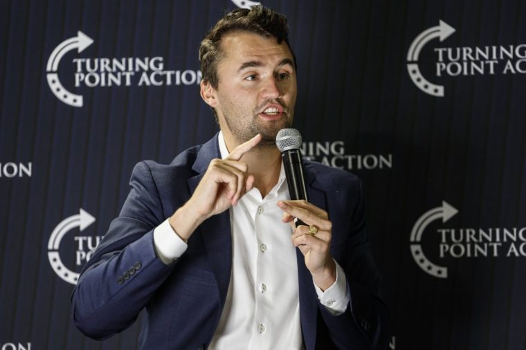 Conservative activist Charlie Kirk speaks during a town hall Monday, March 17, 2025, in Oconomowoc, Wis. (AP Photo/Jeffrey Phelps)