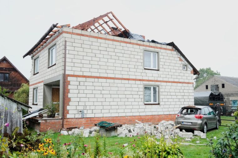 A car damaged by debris falling from a destroyed roof, after Russian drones violated Polish airspace during an attack on Ukraine, in Wyryki near Lublin, Poland, Thursday, Sept. 11, 2025. (AP Photo/Czarek Sokolowski)
