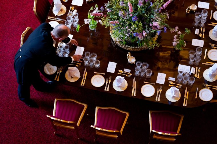 File photo dated 16/09/25 of adjustments being made to table decorations for a State Banquet at Windsor Castle, Berkshire. Donald Trump will be wined and dined at a sumptuous white tie state banquet in Windsor Castle on Wednesday evening. Issue date: Tuesday September 16, 2025. PA Photo. Royal hospitality at its most meticulous and lavish will be deployed in honour of the controversial US president and First Lady Melania Trump as they join some 160 guests in the impressive St George's Hall for the extravagant feast. Photo credit should read: Aaron Chown/PA Wire