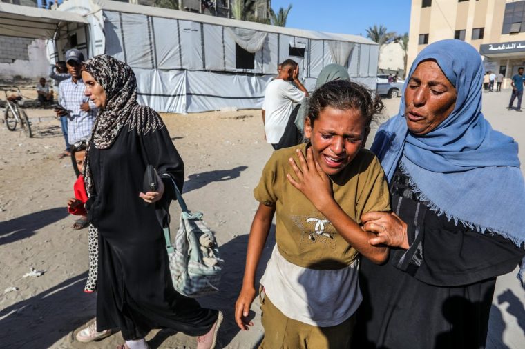 KHAN YUNIS, GAZA - SEPTEMBER 16: Relatives of Palestinians, who lost their lives following the Israeli attacks on people waiting humanitarian aid in Tina region of Rafah, mourn as the bodies are taken from Nasser Hospital for funeral process in Khan Yunis, Gaza on September 16, 2025. (Photo by Abed Rahim Khatib/Anadolu via Getty Images)