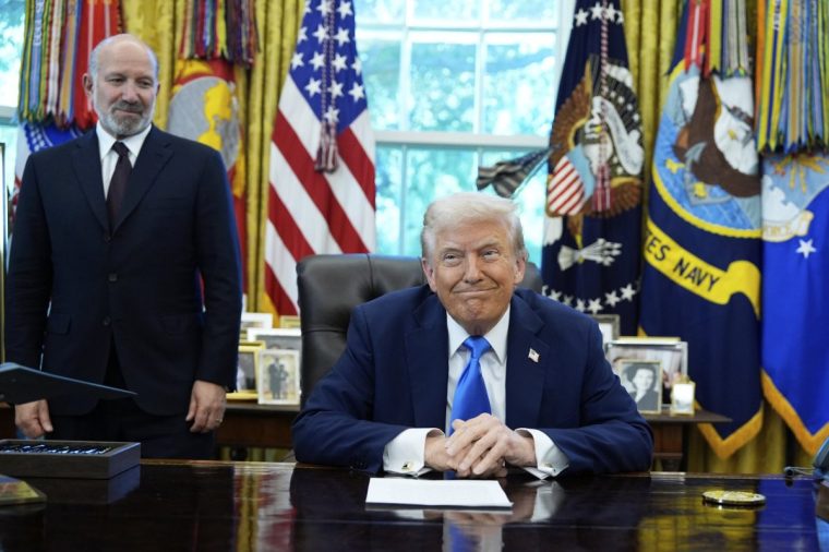 President Donald Trump, right, and Commerce Secretary Howard Lutnick appear in the Oval Office of the White House, Friday, Sept. 19, 2025, in Washington. (AP Photo/Alex Brandon)