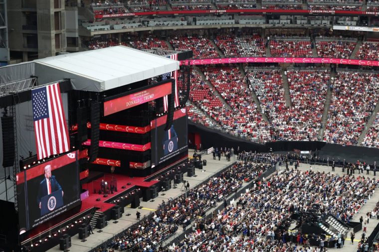 US President Donald Trump speaks during the public memorial service for right-wing activist Charlie Kirk at State Farm Stadium in Glendale, Arizona, on September 21, 2025. (Photo by CHARLY TRIBALLEAU / AFP) (Photo by CHARLY TRIBALLEAU/AFP via Getty Images)