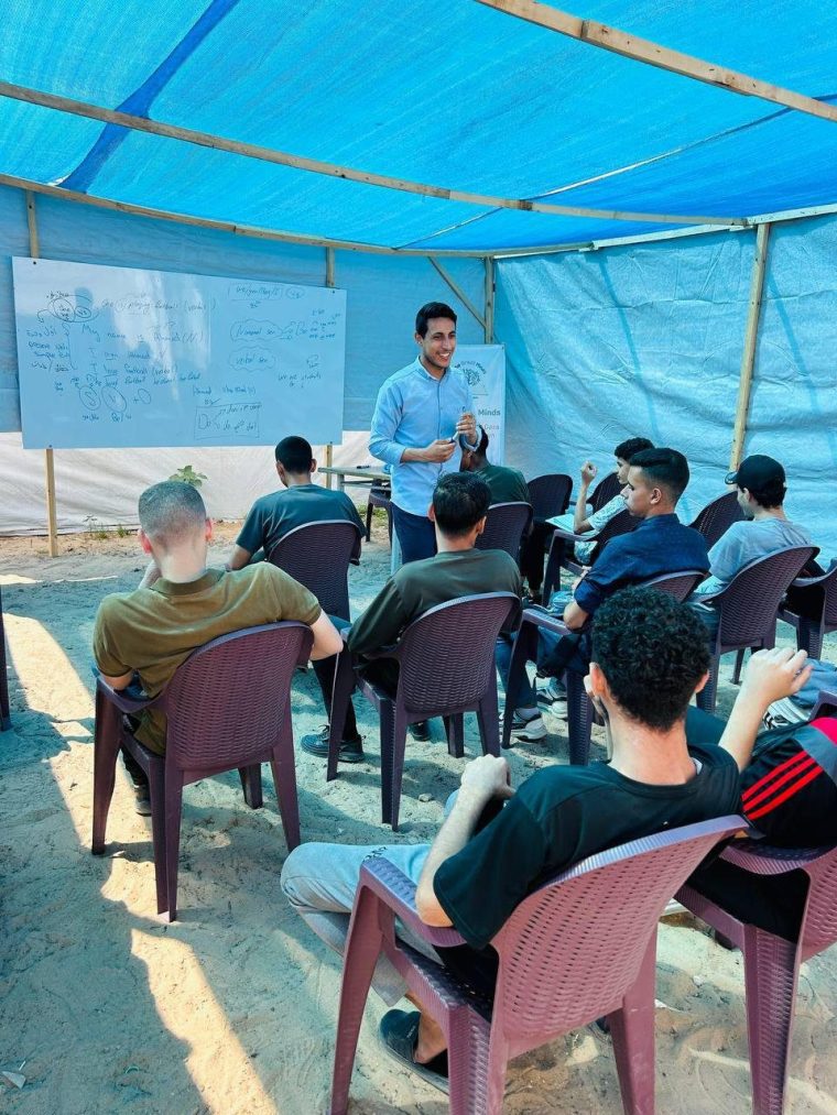 Ahmad Abu Riziq, 29, a teacher and charity worker in Gaza, teaching a class. Permission provided for use to Kyriakos Petrakos.