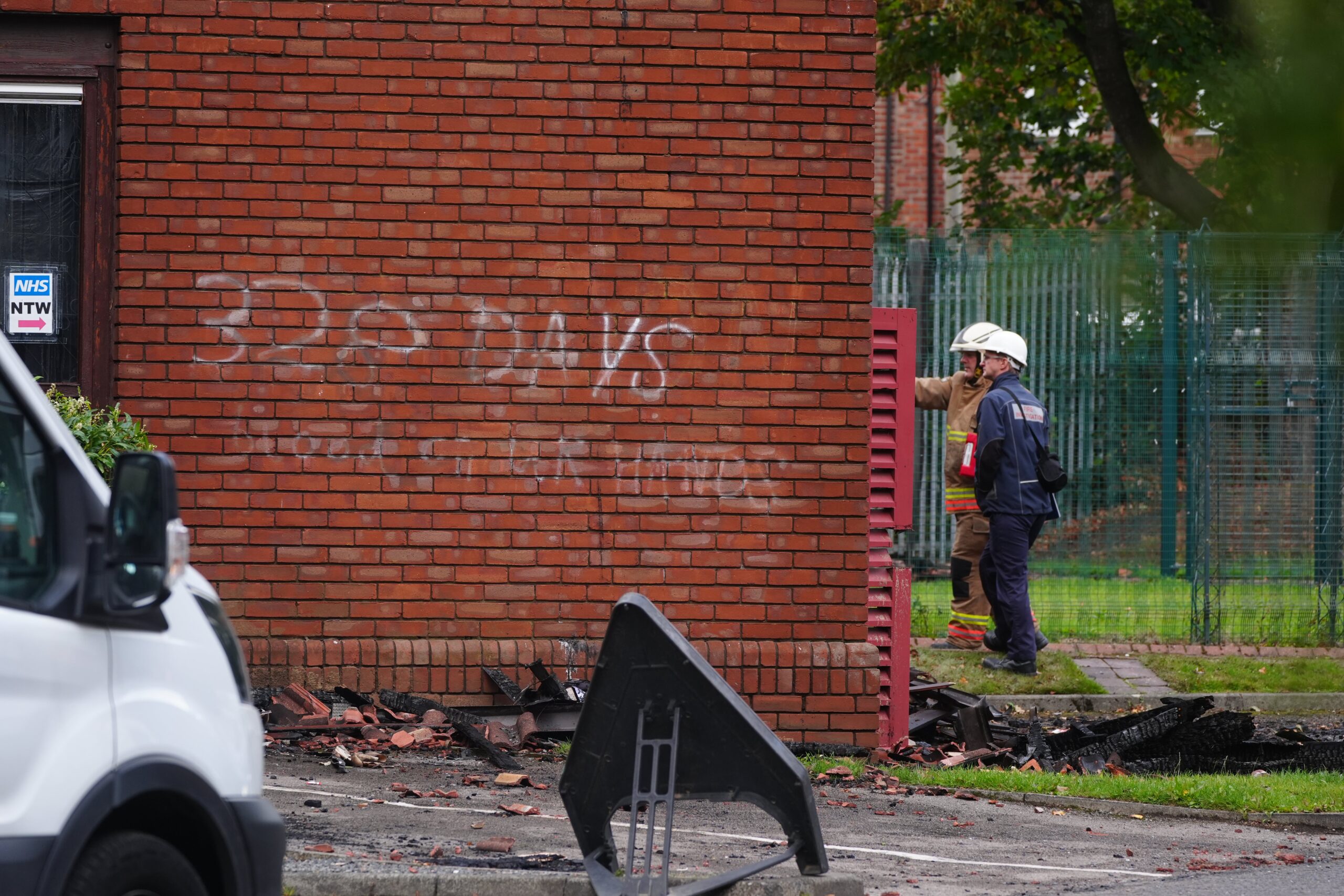 Graffiti on a wall which reads ‘328 days blood on your hands’ as emergency service investigate the damage at Sharon Hodgson's office in Washington, Sunderland
