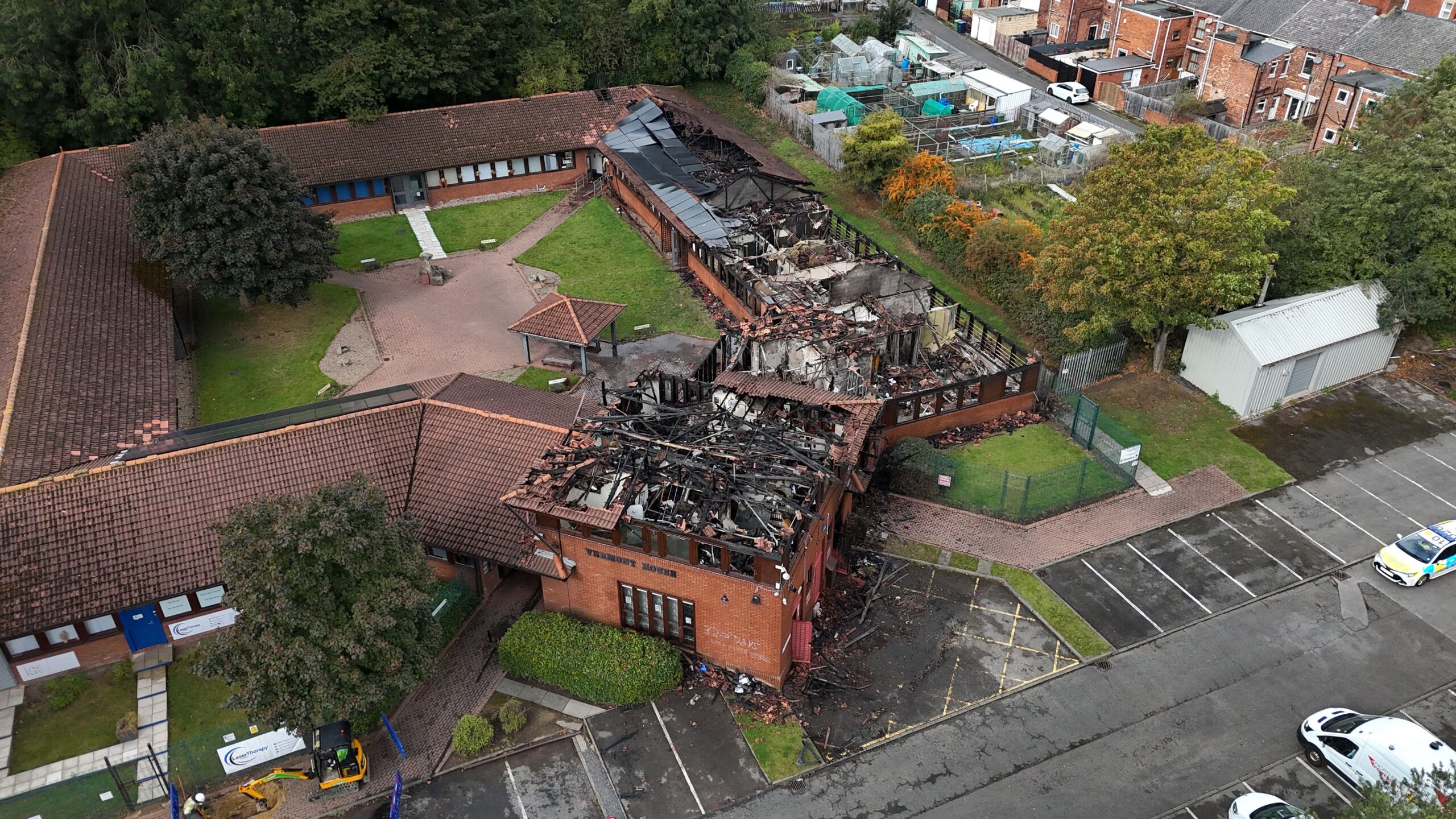 Police at the scene at the MP for Washington and Gateshead South Sharon Hodgson's office in Washington, Sunderland which has been damaged by a blaze