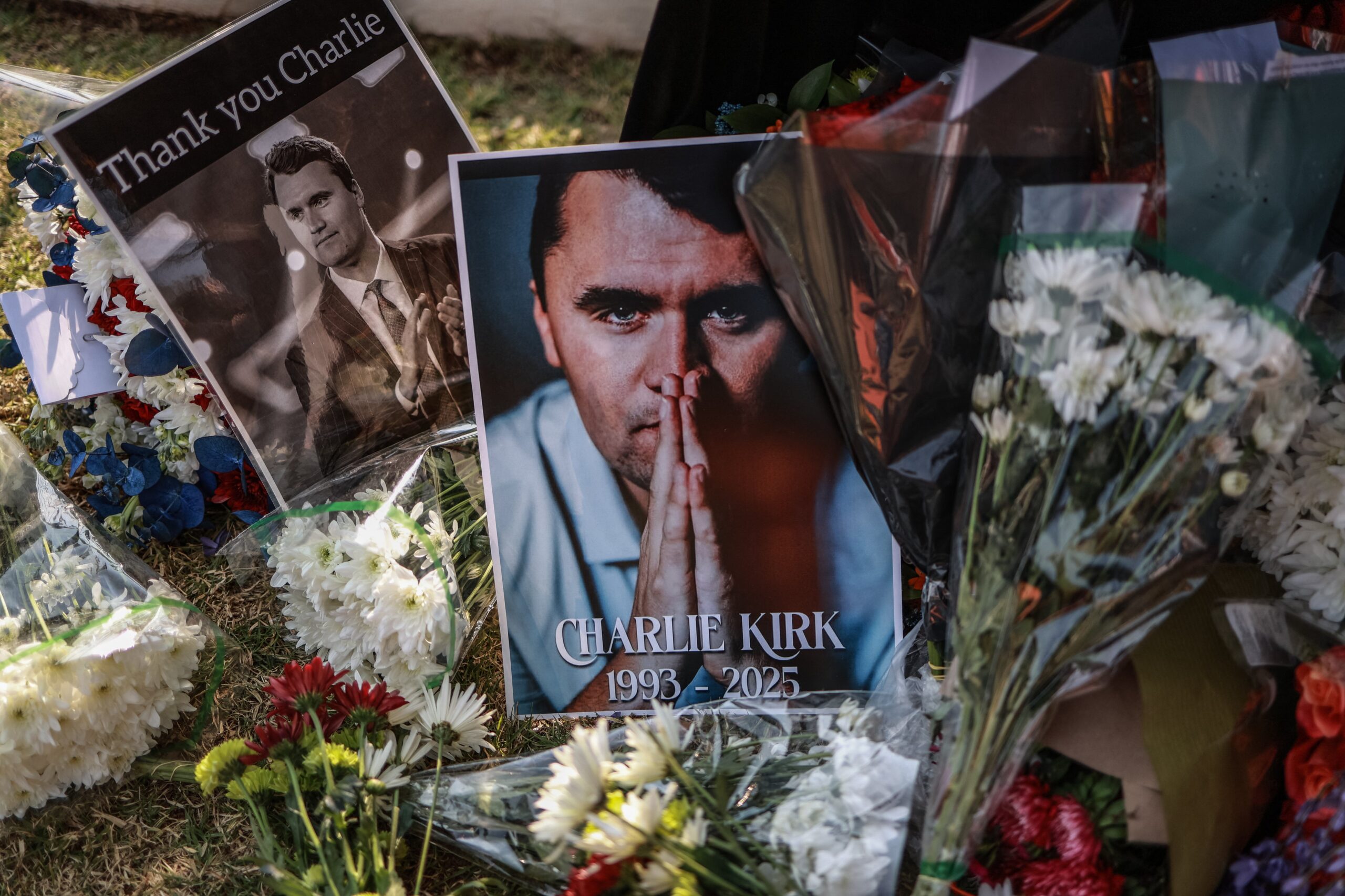 A general view of a wreath laid by mourners outside the US Embassy in Pretoria on September 11, 2025 following the fatal shooting of US youth activist and influencer Charlie Kirk while speaking during an event at Utah Valley University in Orem, Utah, United States