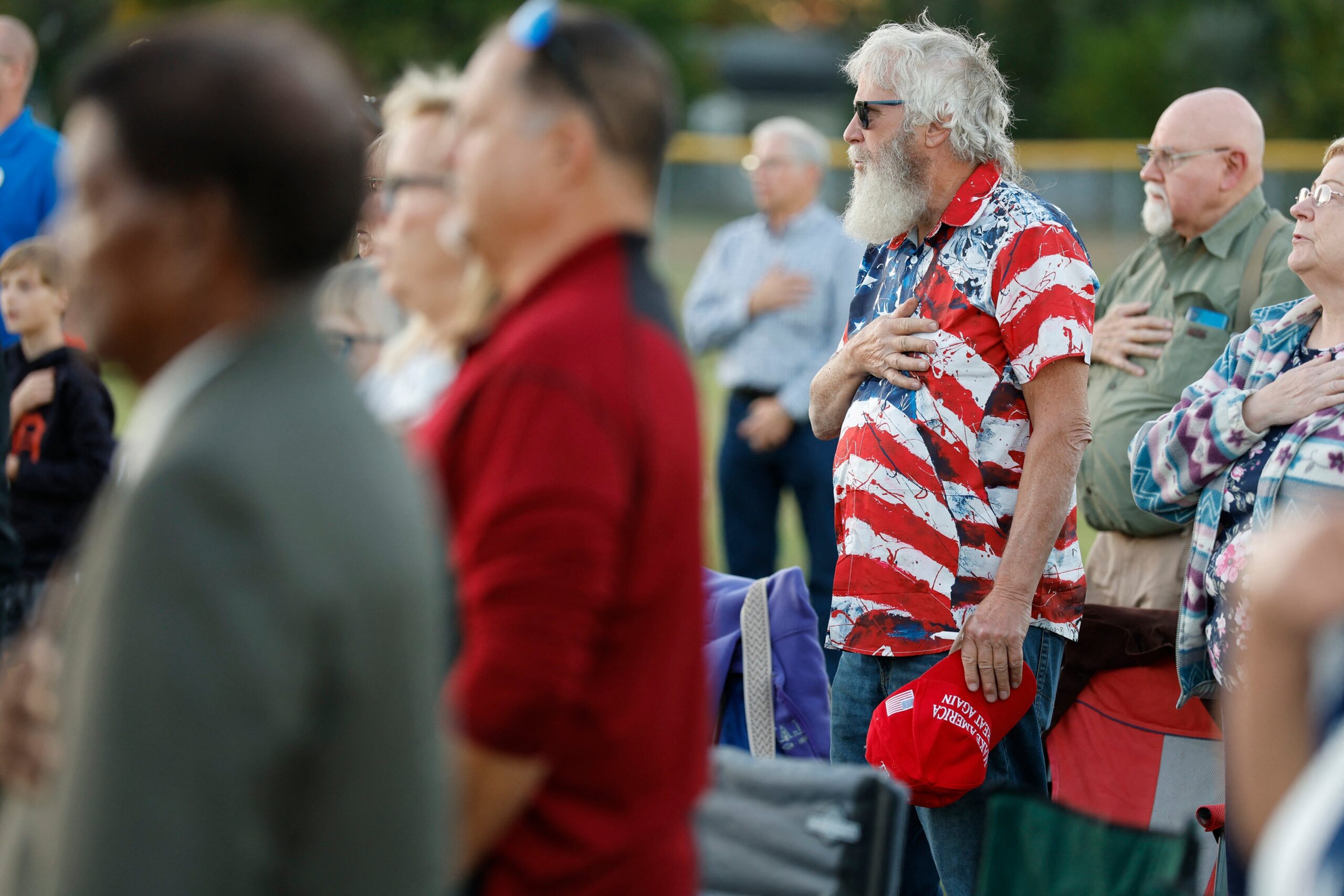 People attend a prayer vigil led by Pastor Fr Georges Bidzogo outside Holy Redeemer Church in Burton