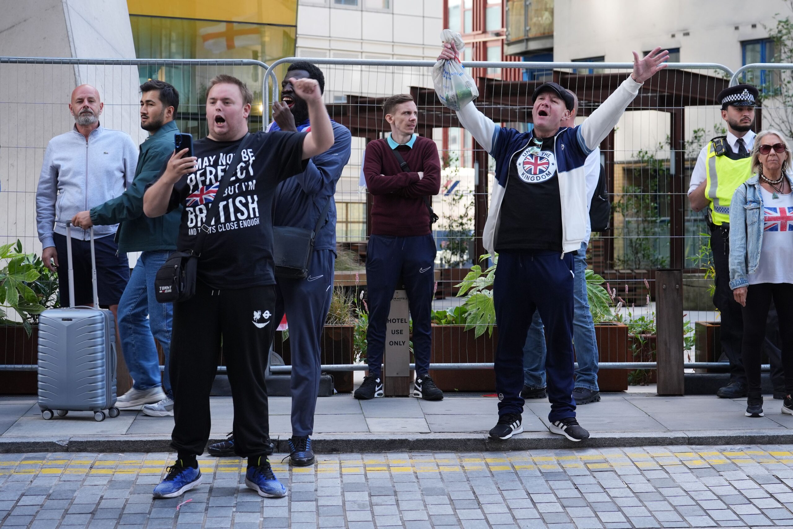 Protesters outside the Britannia Hotel in Canary Wharf (Lucy North/PA)