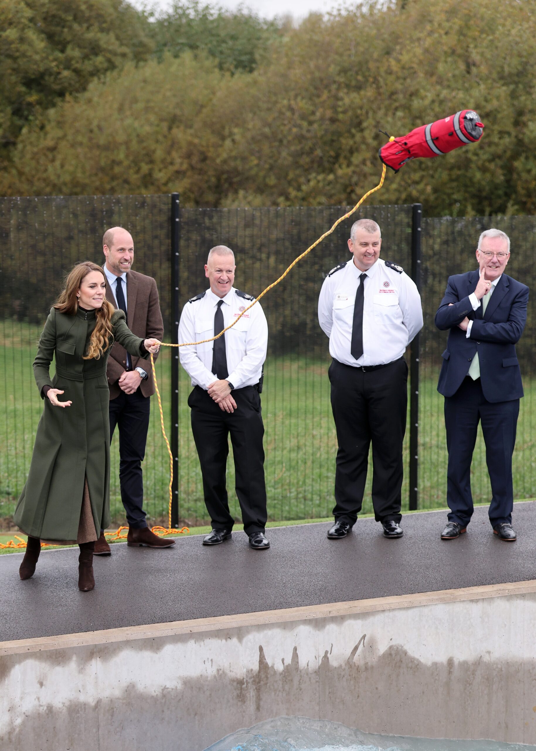 They tried their hand at saving mock casualties who had fallen into the raging torrents of a flood simulator - but failed to throw the line quickly enough