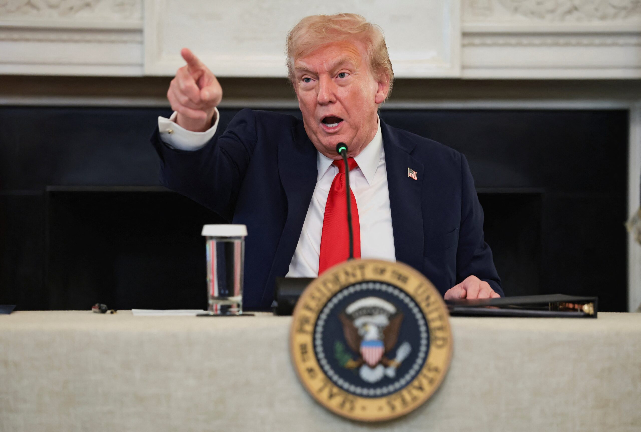 President Donald Trump, in one of many animated moments during a roundtable on Antifa he hosted with right-wing influencers in the White House on October 8, 2025. REUTERS/Evelyn Hockstein