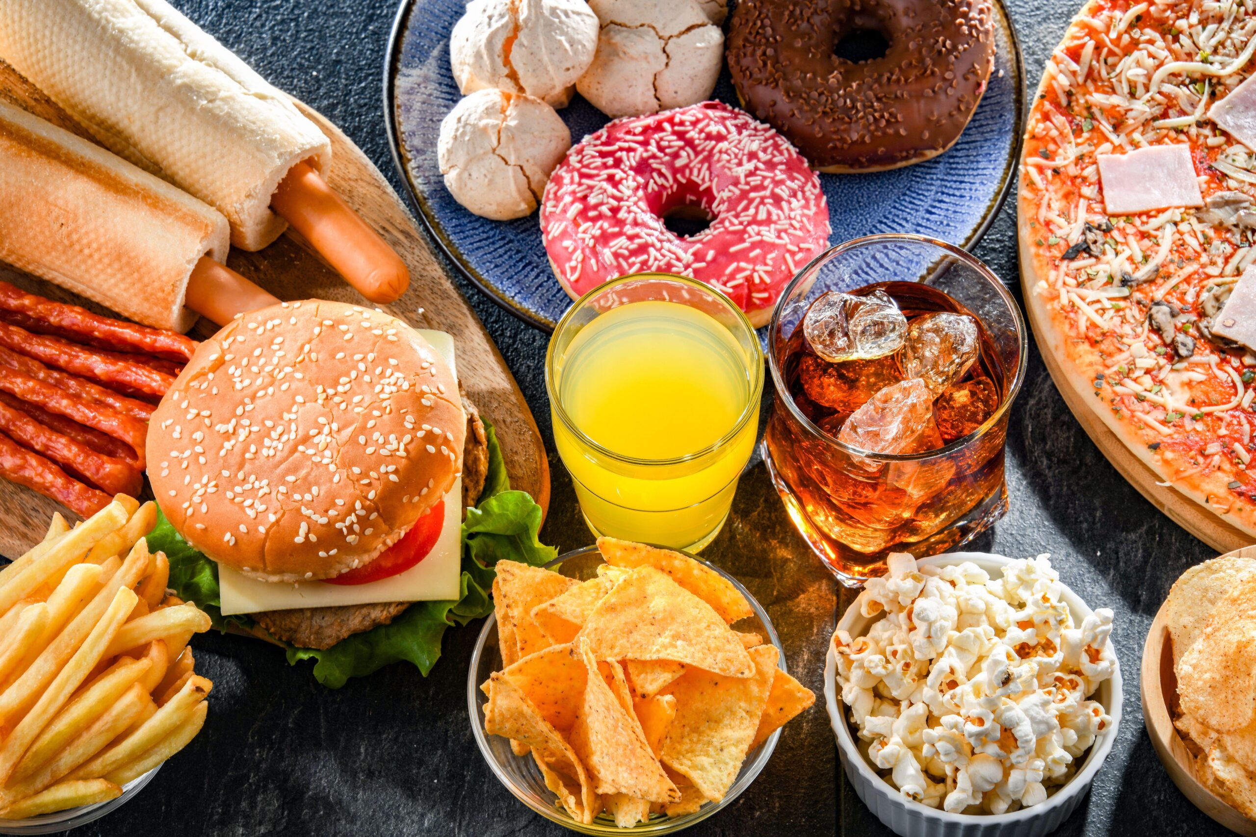 Fizzy drinks that contain sugar, such as full-fat cola, and food that is high in fat or sugar, such as crisps, chocolate, ice creams, cakes, fish fingers and even some pizzas, all fall under the new ban