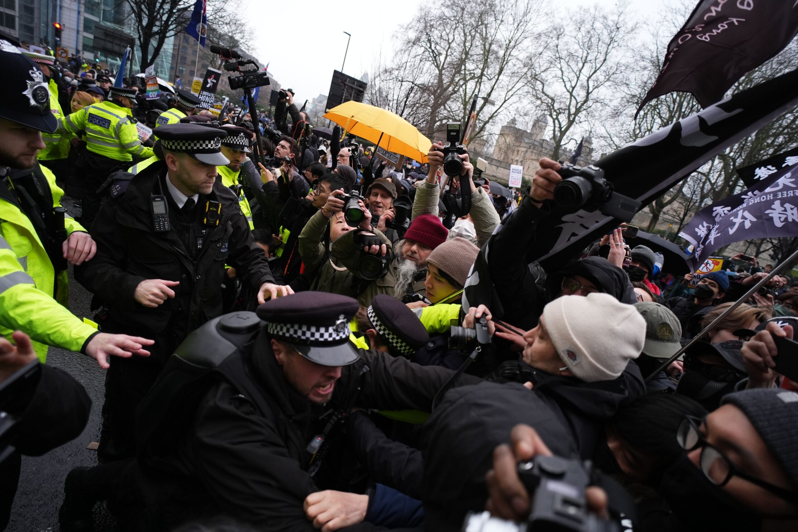 Police officers hold back protesters outside the proposed site of the new Chinese Embassy redevelopment in Royal Mint Court central London, during a demonstration in February (Jordan Pettitt/PA)