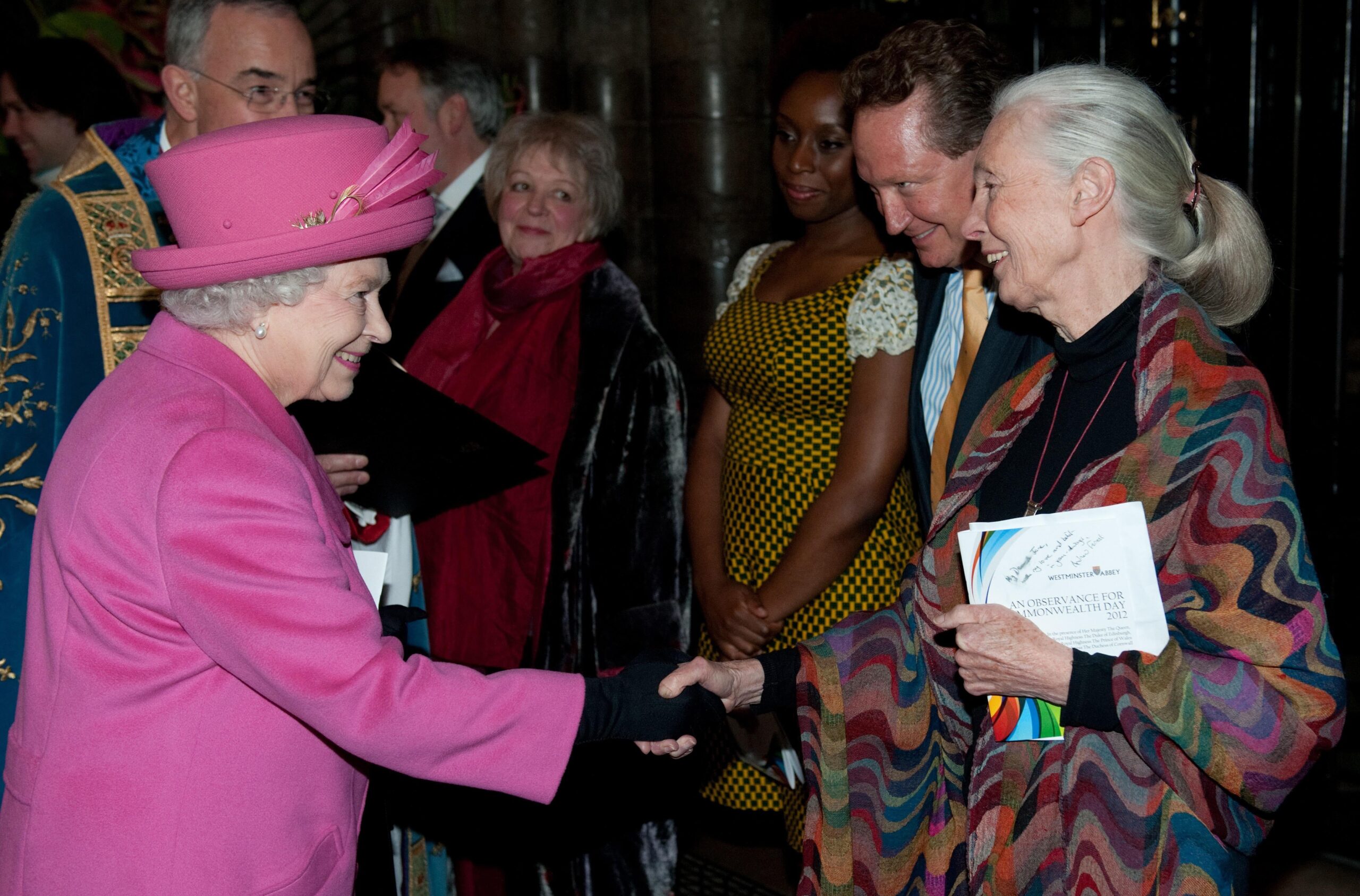 Dame Jane shaking hands with Queen Elizabeth II in 2012